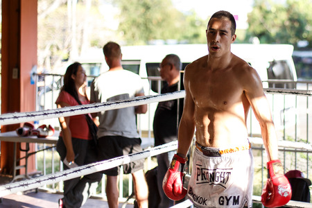 THAILAND - FEBUARY 11 2014: International fighters take part in warmup training for the upcoming Prison Fight round 6 competition in Khlong Phai Prison, Thailandのeditorial素材