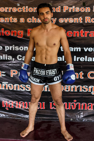 THAILAND - FEBUARY 11 2014: International fighter Mohammed Bouazza takes part in warmup training for the upcoming Prison Fight round 6 competition in Khlong Phai Prison, Thailandのeditorial素材