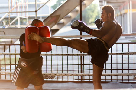 THAILAND - FEBUARY 11 2014: International fighters take part in warmup training for the upcoming Prison Fight round 6 competition in Khlong Phai Prison, Thailandのeditorial素材