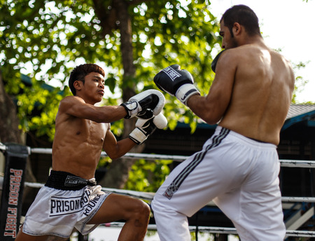 THAILAND - FEBUARY 13 2014: Prison fight / muay thai competition between international fighters and inmates within the walls of KhlongPai Prison, Thailandのeditorial素材