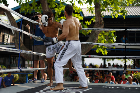 THAILAND - FEBUARY 13 2014: Prison fight / muay thai competition between international fighters and inmates within the walls of KhlongPai Prison, Thailandのeditorial素材