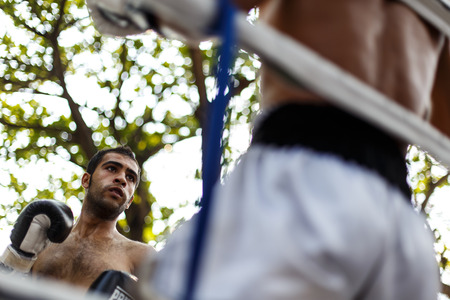 THAILAND - FEBUARY 13 2014: Prison fight / muay thai competition between international fighters and inmates within the walls of KhlongPai Prison, Thailandのeditorial素材
