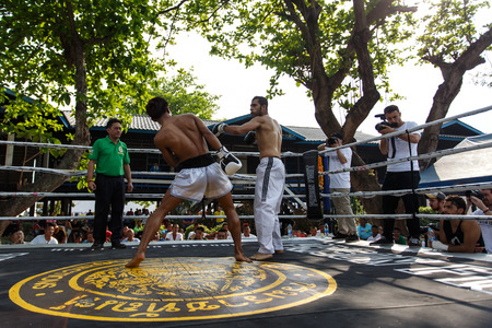 THAILAND - FEBUARY 13 2014: Prison fight / muay thai competition between international fighters and inmates within the walls of KhlongPai Prison, Thailandのeditorial素材