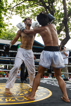 THAILAND - FEBUARY 13 2014: Prison fight / muay thai competition between international fighters and inmates within the walls of KhlongPai Prison, Thailandのeditorial素材