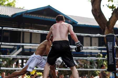 THAILAND - FEBUARY 13 2014: Prison fight / muay thai competition between international fighters and inmates within the walls of KhlongPai Prison, Thailandのeditorial素材