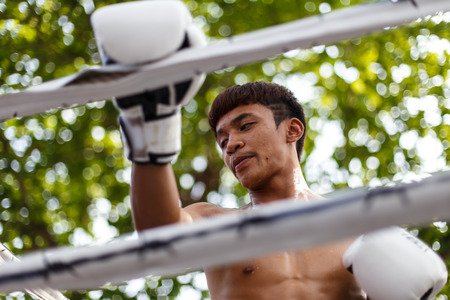 THAILAND - FEBUARY 13 2014: Prison fight / muay thai competition between international fighters and inmates within the walls of KhlongPai Prison, Thailandのeditorial素材
