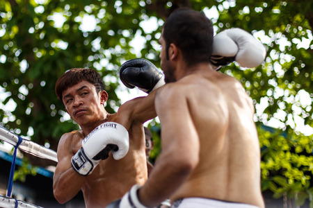 THAILAND - FEBUARY 13 2014: Prison fight / muay thai competition between international fighters and inmates within the walls of KhlongPai Prison, Thailandのeditorial素材