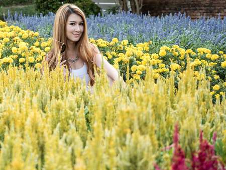 Beautiful Blonde Thai Asian Model Poses in Outdoor Natural Settingの写真素材