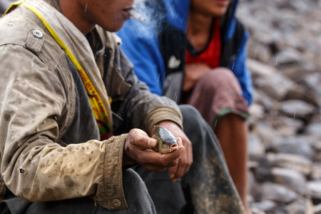 FALAM, MYANMAR - JUNE 17 2015: Fishermen at the start of the monsoon season in the recently opened to tourists Chin State region of Western Myanmar (Burma)のeditorial素材
