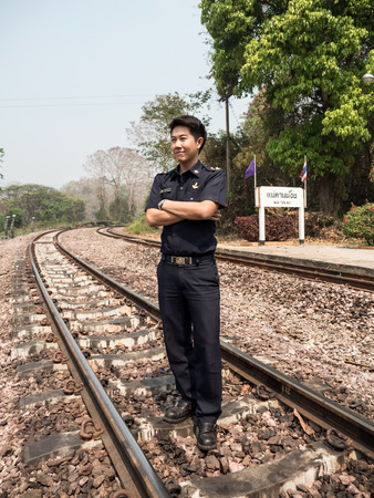 MAE TAN NOI, THAILAND - MARCH 22 2015: Tain Master in natural train station Mae Tan Noi on one of the hottest recorded days in Northern Thailand.のeditorial素材