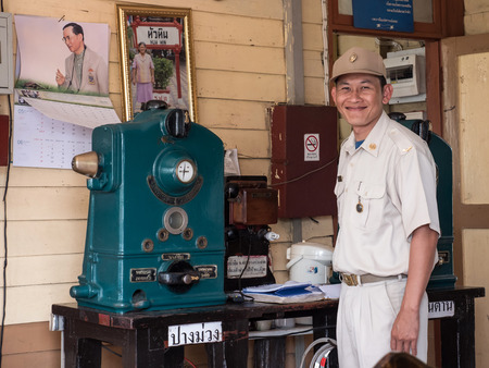 MAE TAN NOI, THAILAND - MARCH 22 2015: Officers continue to work at remote train station Mae Tan Noi on one of the hottest recorded days in Northern Thailand.のeditorial素材
