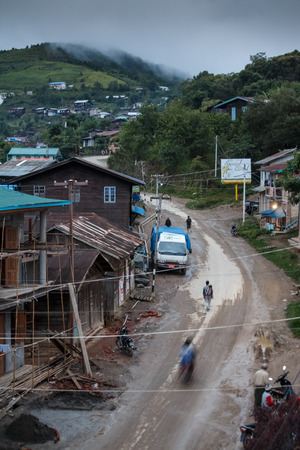 TEDIM, MYANMAR - JUNE 17 2015: Street life going on in the hill village of Tedim in recently opened to tourists Chin State, Myanmar (Burma).のeditorial素材