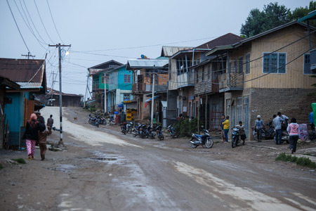 TEDIM, MYANMAR - JUNE 17 2015: Street life going on in the hill village of Tedim in recently opened to tourists Chin State, Myanmar (Burma).のeditorial素材