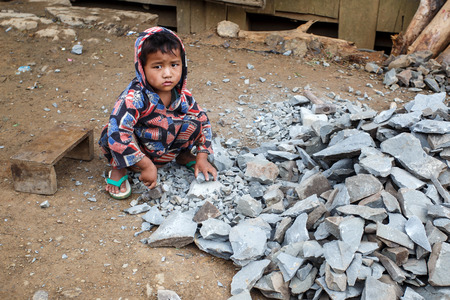 CHIN STATE, MYANMAR - JUNE 22 2015: Child labour in the recently opened for tourists Chin State Mountainous Region, Myanmar (Burma)のeditorial素材