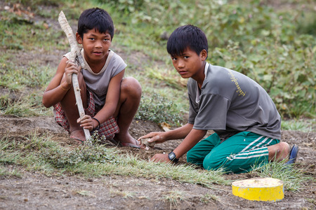 CHIN STATE, MYANMAR - JUNE 22 2015: Local village boys in the recently opened for tourists Chin State Mountainous Region, Myanmar (Burma)のeditorial素材