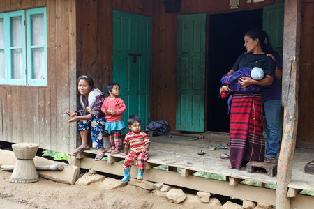 FALAM, MYANMAR - JUNE 17 2015: Local family in the recently opened to foreigners area of Chin State - western Myanmar (Burma)のeditorial素材