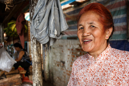 CHIN STATE, MYANMAR - JUNE 18 2015: Lady in marketplace in the recently opened for tourists Chin State Mountainous Region, Myanmar (Burma)のeditorial素材