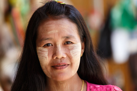 CHIN STATE, MYANMAR - JUNE 18 2015: Beautiful lady with thanaka painted face in the recently opened for tourists Chin State Mountainous Region, Myanmar (Burma)のeditorial素材