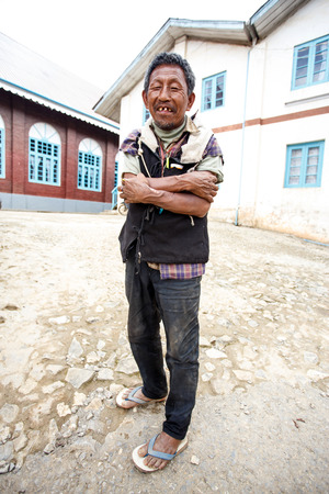 CHIN STATE, MYANMAR - JUNE 18 2015: Local man with bad teeth in the recently opened for tourists Chin State Mountainous Region, Myanmar (Burma)のeditorial素材