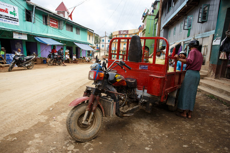 CHIN STATE, MYANMAR - JUNE 18 2015: Motorbike adapted goods vehicle in the recently opened for tourists Chin State Mountainous Region, Myanmar (Burma)のeditorial素材
