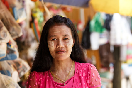 CHIN STATE, MYANMAR - JUNE 18 2015: Beautiful lady with thanaka painted face in the recently opened for tourists Chin State Mountainous Region, Myanmar (Burma)のeditorial素材