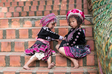 CHIN STATE, THAILAND - OCTOBER 15 2016: Children on the steps of Wat Doi Suthep in mourning the...