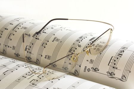 Close up of the music book and glassesの写真素材