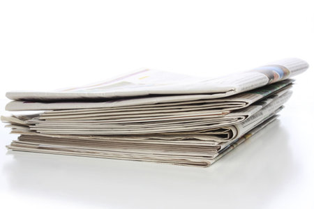 Stack of local, regional, national and international newspapers