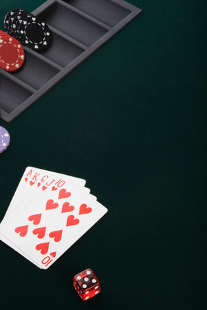 Poker cards and chips on green table