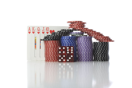 Poker cards and chips reflected on table