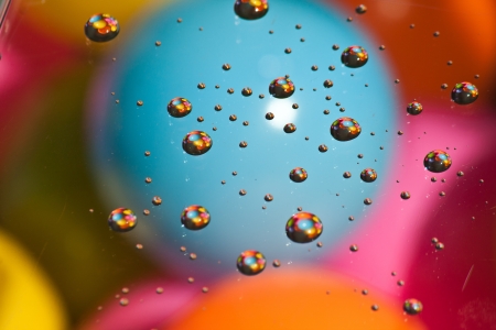 Abstract water drop on colourful ballの写真素材