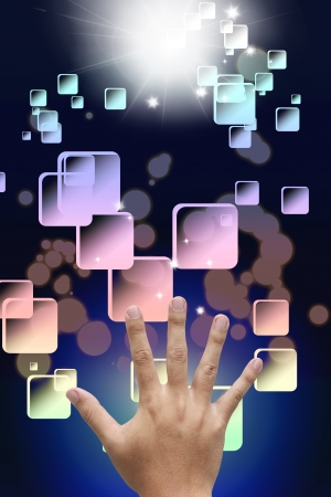 Hand choosing some button on abstract backgroundの写真素材
