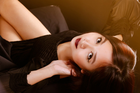 Portrait of Asian lady on black background with vintage filterの写真素材