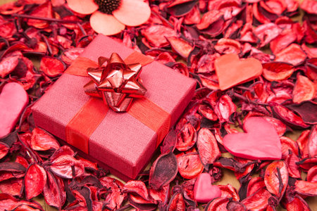 Red gift with hearts and decorate with dry flower- Valentines day concept