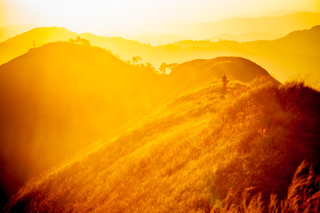 Dramatic sunset with traveler standingの写真素材