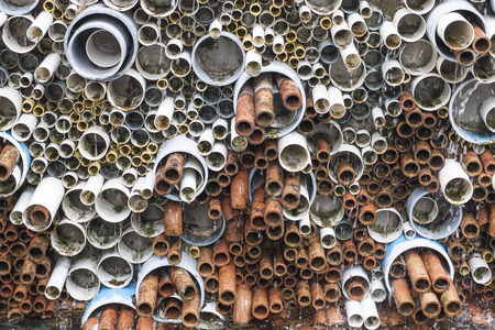 Abstract background of stack pipes wallの写真素材