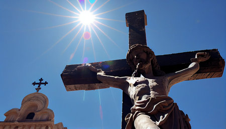 Crucifixion of Jesus Christ in front of the blue skyの素材