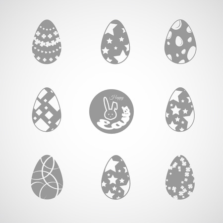 Vector collection of gray Easter eggs icons with different patterns on the gradient background.のイラスト素材