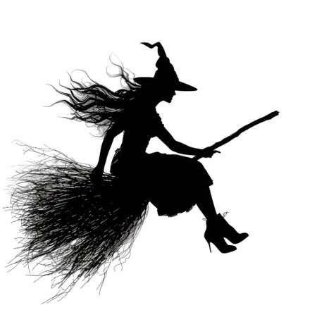 A black silhouette of a witch with long flowing hair flying on a broomstick against a black background.の素材