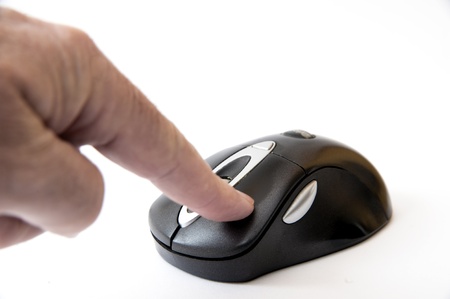 Zeigefinger drückt auf Maustasteの写真素材