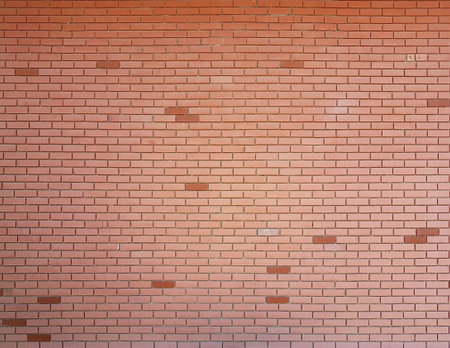 red smooth brick wall texture with dark colored bricks
