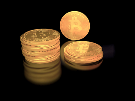 stack of golden bitcoin tokens on black background with reflectionの写真素材