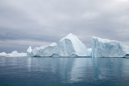 Icebergs in the famous icefjord beside the city of Ilulissat in Greenland. の写真素材