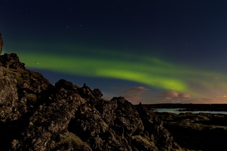 Green aurora or northern lights at the Blue Lagoon spa in Icelandの写真素材