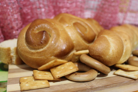 Bread, rolls and cookie, lying on a cook-tableの写真素材