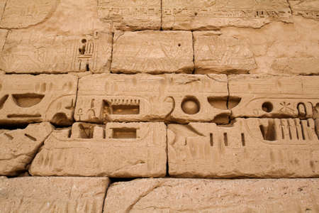 Ancient hieroglyphs on the temple wall of Medinet Habu, Thebes in Egyptの写真素材