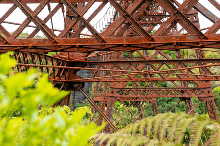 Old unused iron train bridge at the Old Coach Road, North Island of New Zealandの写真素材