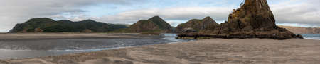 Tranquil bay of Whatipu beach near Auckland, New Zealandの写真素材