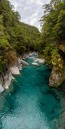 Colorful blue mountain river at the Haast pass, South Island of New Zealandの写真素材