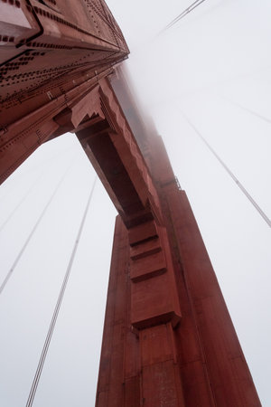 Beneath a giant pillar of the Golden Gate Bridge, San Francisco, USAの写真素材